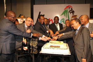 Amb. Chika and group of Ambassadors cutting the Jamhuri Cake